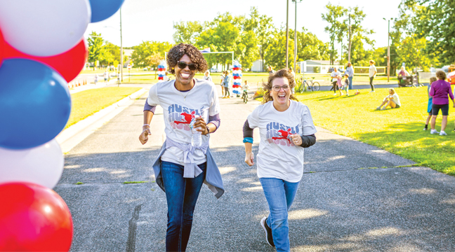 What a feeling to cross the finish line as Marie Lyne St Fleur and Lynel Johnson do it with all smiles. (Submitted Photo).