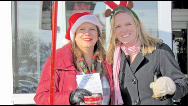 CVBC MEMBERS Lori Johnson (Johnson Materials, Inc.) and Jenny Massmann (American Heritage National Bank) braved the cold Thursday to ring the bell for the Salvation Army in front of Coborn’s in Clearwater. (Photo by Penny Leuthard)