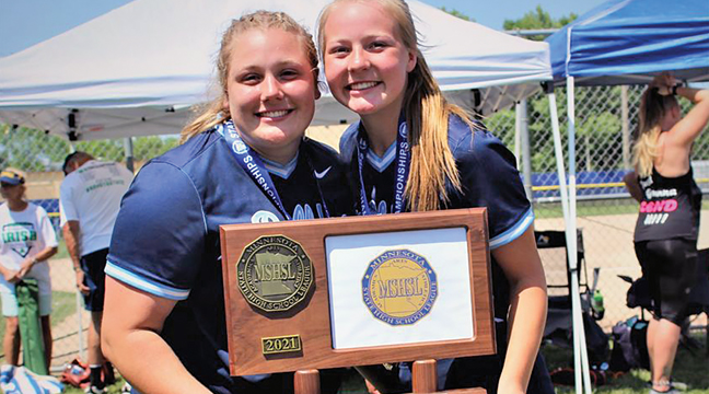 Emma Eickhoff (L) and Kurstyn Patnode posed with the state title trophy.  Patnode earned All-State status after this season, while Eickhoff was named to play in the state all star game. (Submitted Photo).