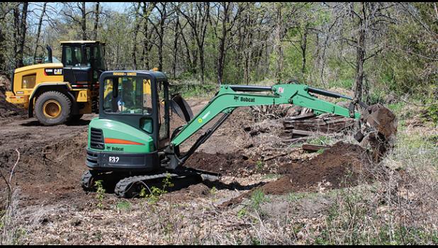 Abe Knowles excavating some dirt at Sportsman's Park to use as fill for the new playground equipment.