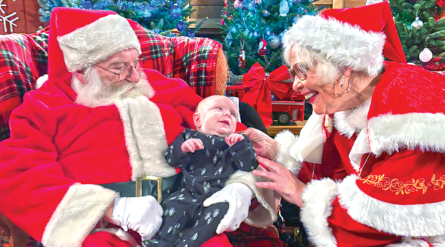 Clayton Halvorson, 13 weeks visited with Mr. and Mrs. Claus for the first time ever — Parents are Bryce and Bryanna Halvorson of Becker. (Photo by Mary Nehring.)