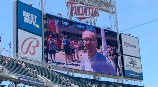 LOCAL PALMER MAN HONORED AT MN TWINS GAME. South Santiago Lutheran Church member Paul Fors was honored by the Minnesota Twins with raising the American Flag in center field at a recent Twins game. Fors is a decorated Korean War veteran who loves Jesus. He is described as a truly kind man, a terrific friend and a mainstay at the Tuesday morning Men’s Bible Study held at SSLC.  (Submitted Photo.)