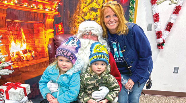 Marley and June Turnquist enjoyed their time with their Grandma (Peggy Gilyard) and Santa at Santiago Township Hall Sunday, December 7. (Submitted Photo).