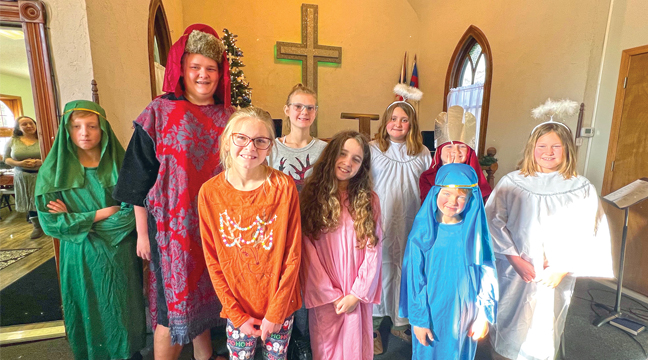 THE STORY OF CHRISTMAS.  Snake River youth are pictured during their re-enactment of Jesus’ birth. Top photo: Abe Gallagher, Levi Schulte, Anna Person, Savannah Schulte, Caden Hoeft, Olivia Schulte. Abby Person, Anara Ward, Saul Gallagher.  (Submitted Photo).