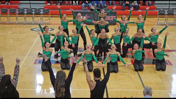 THE BECKER BULLDOGS’ HS KICK TEAM holds their pose at the finale of their routine at sections last weekend. (Submitted Photo)