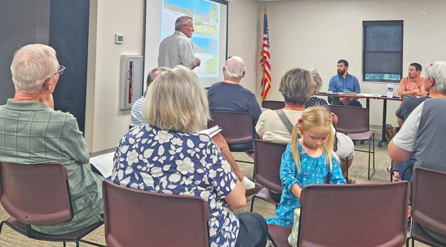 A MEMBER OF THE ANN LAKE ASSOCIATION asked the Orrock Town Board for possible assistance. (Photo by Katherine Cantin.)