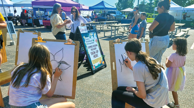 ARTISTS of all ages demonstrated their talents at the GRRL Summer Reading exhibit at the Big Lake Farmer’s Market last week. (Patriot Photo by Deven Haas).