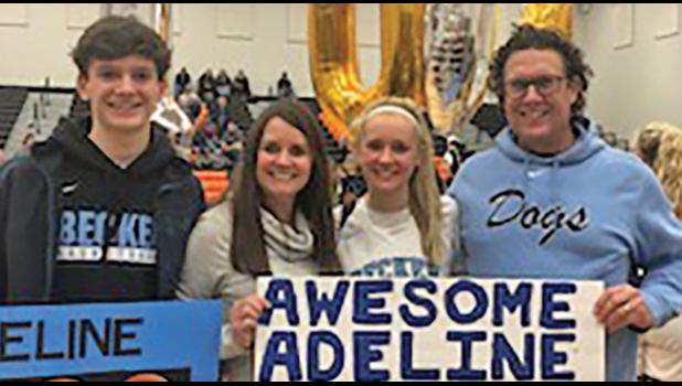 ADELINE KENT (middle) poses with her family who attended the game including brother Harrison (L), mom Julie (M) and dad Brandon (R). 