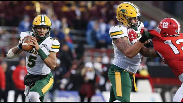 BECKER’S OWN DILLON RADUNZ (R) helps block for QB Trey Lance (right photo) during a game this year for NDSU. Radunz and Lance were named to the FCS ADA All-America Team. (Photos from NDSU website)