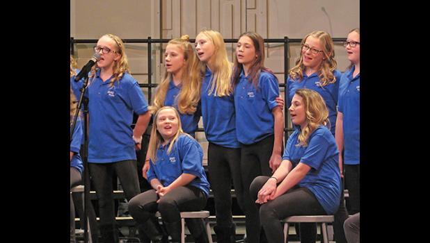 MEMBERS OF THE 7TH GRADE ENSEMBLE HAVE FUN singing When We’re Together during their portion of Thursday 