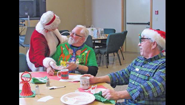 MRS. CLAUS (JANE GOHMAN) distributed candy canes to every Young at Heart guest, regardless of whether they were naughty or nice.