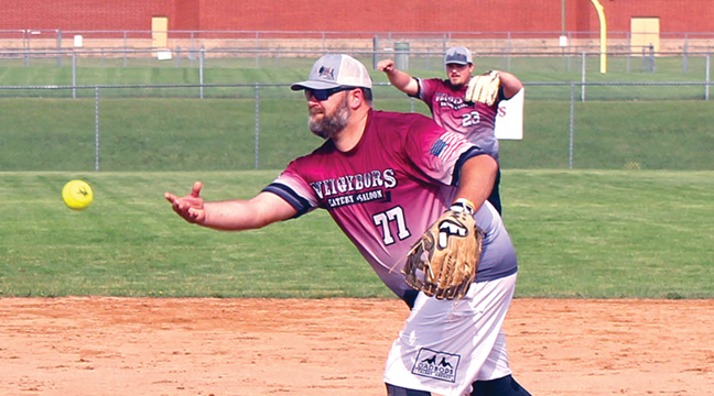 Kory Kreager tosses a pitch to the plate for Neighbor’s Eatery in their first game of the Spud Fest softball tournament. (Photo by Ken Francis)