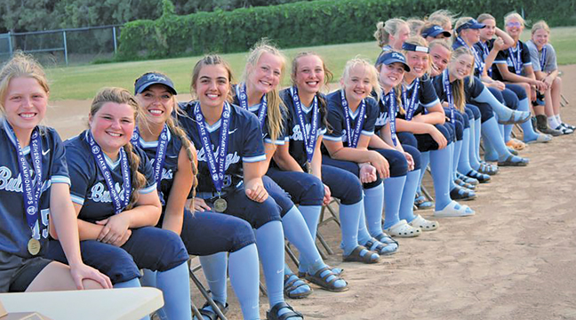 The state champion Becker Bulldog softball team members smiled for the camera at the welcome home ceremony held last week after the team’s 4-0 win over Winona. (Submitted Photo).