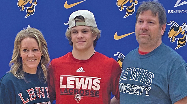NICK MERTEN stood with his parents after signing with Lewis University to play lacrosse. (Submitted Photo).