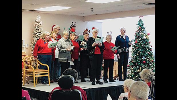 MEMBERS OF CLEARWATER AREA CHURCHES came together earlier this month to spread holiday cheer by singing Christmas carols for the residents of Good Shepherd Nursing Home in Sauk Rapids. (Submitted Photo)