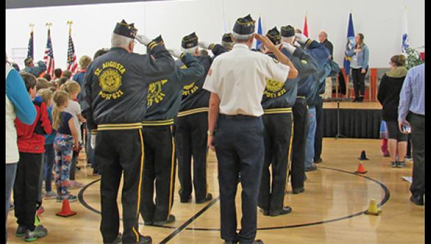 LEGIONNAIRES SALUTE THE FLAG during Clearview’s Veterans Day program. (Photo by Penny Leuthard)