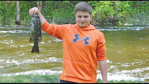 Tristin Platz with a 2 pound, 1 1/8 ounce small mouth bass he caught Saturday morning.