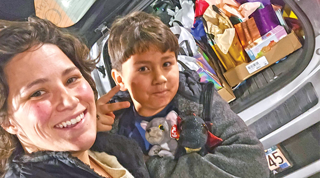 TAYLA LIST (L) and her son, Ezekiel with the back end of their vehicle packed with care packages to be delivered to the Mayo Clinic in Rochester. (Submitted Photo).