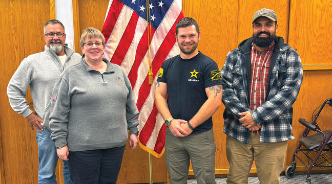 LOCAL VETERANS Doug Schultz, Ketti Green, Patrick Bevans, and Emmanuel Corona stand in front of the American flag. (Patriot Photo by Don Bellach)