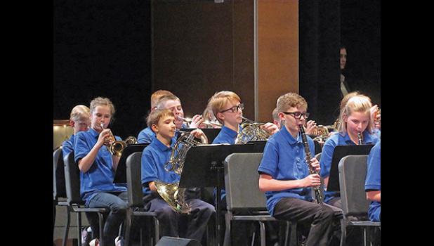 SIXTH-GRADE BRASS AND WOODWINDS perform a piece for the audience during their recent winter concert. (Photo by Penny Leuthard)