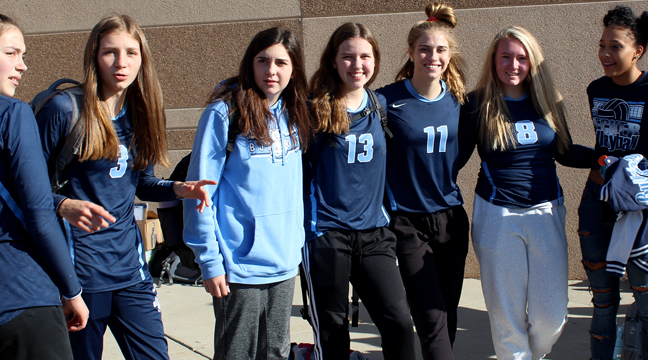 THE BULLDOG VARSITY VOLLEYBALL PLAYERS were pumped and ready to go before their game against North Branch. From left to right: Lilly Berger, Macy Spear, Maya Wenner, Ella Tracy, Taylen Messick, Slylee Blomquist, and Maurissa Crossland. (Photo by Katherine Cantin.)