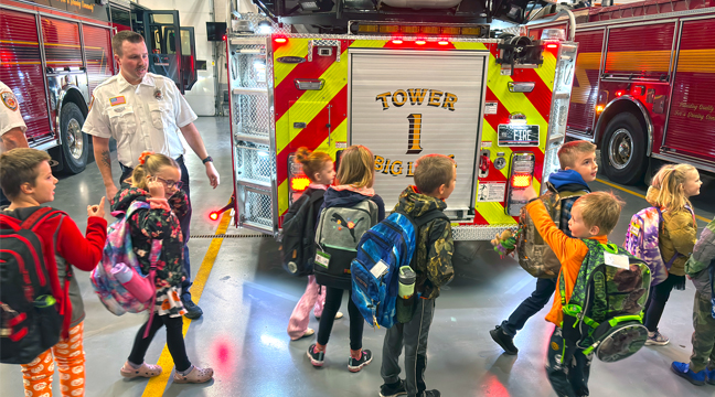 Children explored the fire trucks  before they would take the contestant winners to school. (Patriot Photo by Don Bellach) 