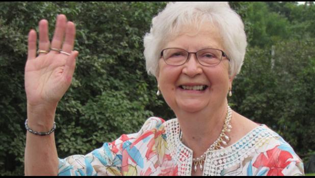 GRAND MARSHAL ELAINE PAUMEN waves to the crowd during Clearwater’s Heritage Days parade in August. (Photo by Penny Leuthard)