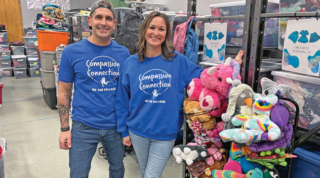 Kevin and Amy Drehmel welcomed the community to Monday evening’s Open House for the Compassion Connection.  The 501(c)-3 charity provides an array of services for foster and adoptive families, as well as community members who are in need of support (photo by Mark Kolbinger).
