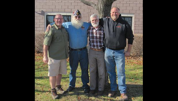 “The Monument Guys,” Keean Raygor, Roger Bigalke, Mike McDowall and Al Scherping in the spot designated for the new veteran’s monument in front of Becker City Hall. (Photo by Penny Leuthard)