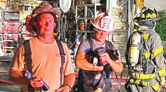 THE HOMEOWNER’S CAT (middle) was rescued and cared for by firemen and even a neighbor who provided a pet taxi for the family. (Submitted Photo).