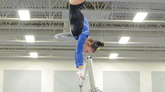 Lola Visci (R) took first on bars. (Photo by Paul Krumrei).