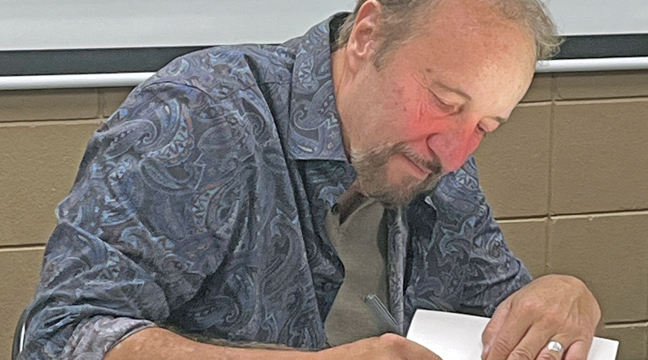 MINNESOTA AUTHOR FRANK WEBER visited the Becker Library last week to promote his new book, The Sun — part two of a series including a book entitled, Scandal of Vandals. (Patriot Photos by Carol Hanson).