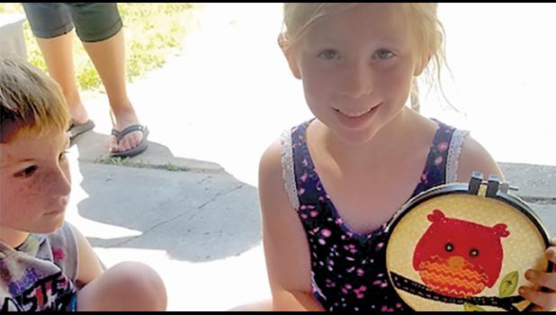 CLOVER BUD HADLEY MAFADDEN with her handstitched owl she entered at the Wright Co. Fair. (Submitted Photo)