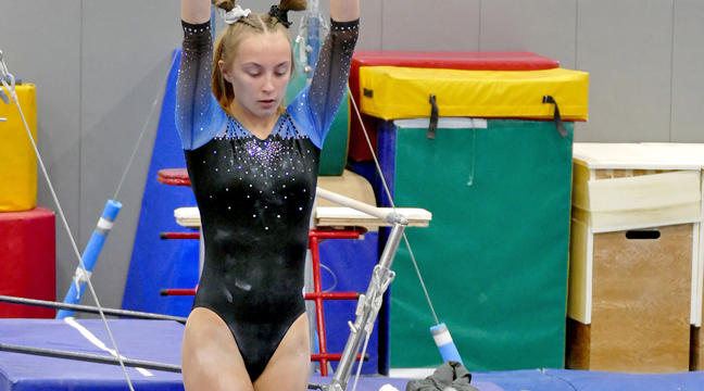 Emma Hennessy has been a stellar competitor for the Bulldogs this season.  Here she is pictured on the Beam in a recent match versus North Branch. (Submitted photo.)