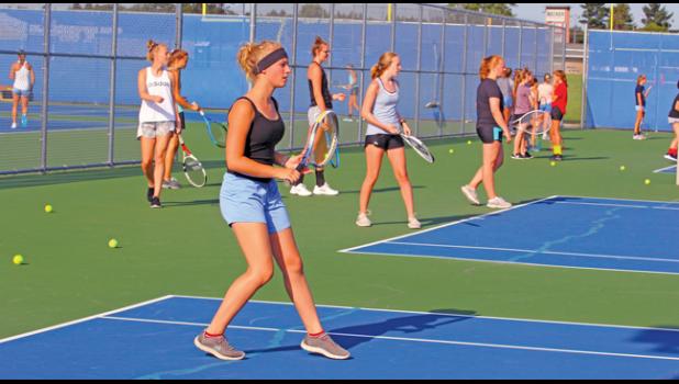 MEMBERS OF THE GIRLS TENNIS TEAM practiced hard this week on the high school tennis courts in preparation for their upcoming season. (Photos by Bill Morgan).