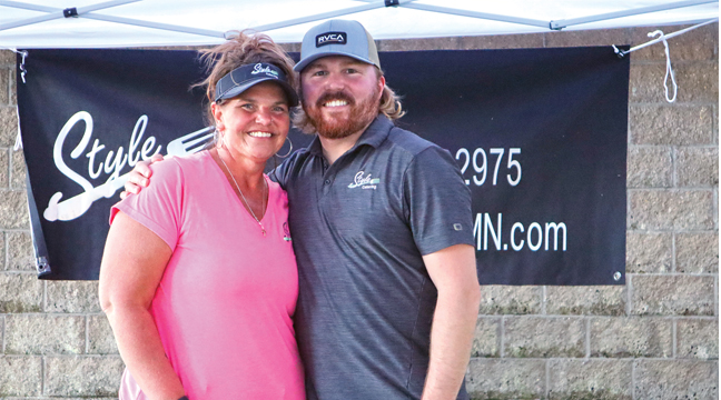 STACY BORCHARDT (L) and KYLE GEROUX (R) of StYle CatEring manned the refreshment tent to tend to the needs of the large crowd Thursday at Lakeside Park.