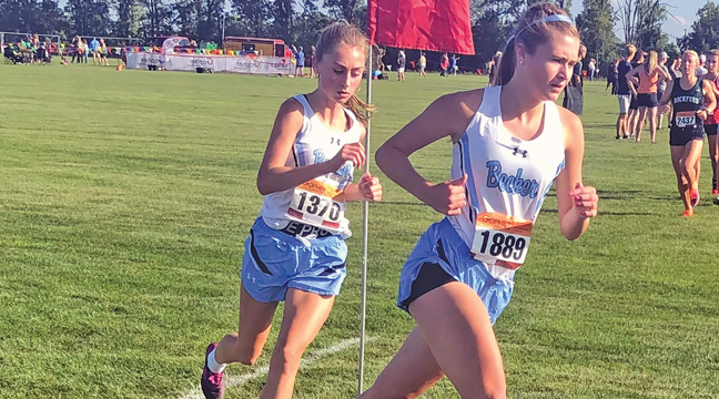 OLIVIA BABLER AND BELLA DUNCOMBE paced each other as they passed a marker during their race at Big Lake Tuesday. (Submitted Photo)