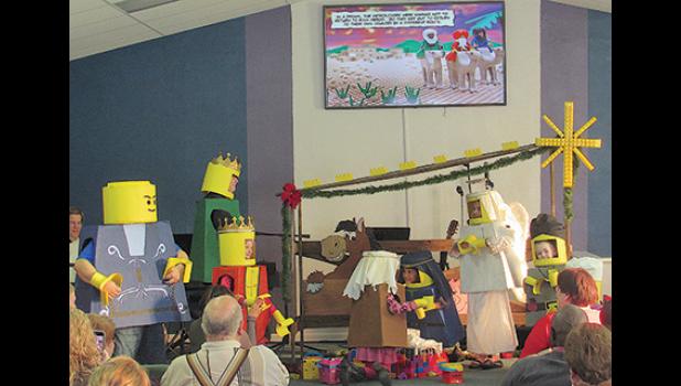 YOUTH AT LIVING WATERS CHURCH in Clear Lake enact a LEGO® Christmas for family and friends Sunday morning. (Photo by Penny Leuthard)