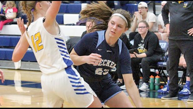 MEGAN GAMBLE side-stepped Big Lake’s Reagan Sternquist en-route to two of her 21 points Tuesday at home. (Photo by Bill Morgan)