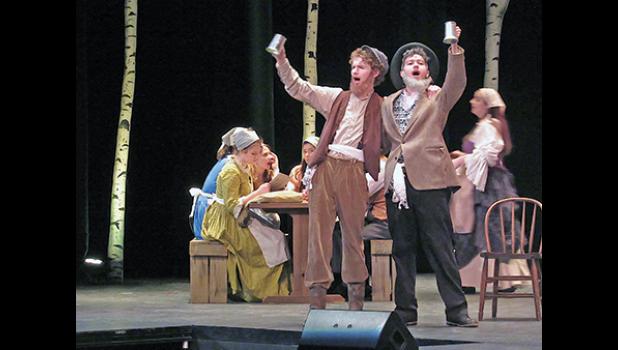 TEVYE (NATHANIEL HED) and Rabbi (Carter Aanenson) toast “life” during Fiddler on the Roof Friday night. (Photo by Penny Leuthard)