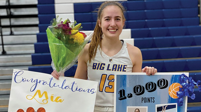 BIG LAKE’S MIA HUBERTY (#13) was the Hornets’ leading scorer with 16 points. She and her teammates were hounded all night just as Becker’s Adeline Kent (above) demonstrates. (Photo by Bill Morgan)