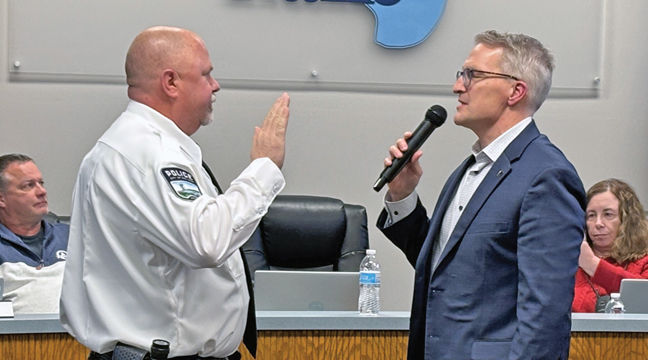 Mayor Paul Knier swears in Chief of Police Sam Olson during the latest Big Lake City Council meeting. (Submitted Photo)
