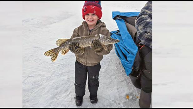 LITTLE FISHERMAN ON ELK LAKE. Jace Woolard was very proud of the fish he watched the big boys catch on New Years Day near Palmer! Jace enjoyed spending time on the ice with his dad (Jake Woolard) and family friends Zack and Mike Johnson. (Submitted photo). 