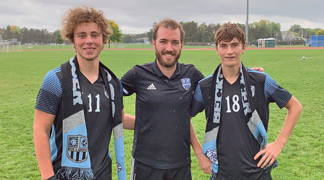 The Becker Bulldog boys soccer team recently honored its Seniors, Beau Biegler and Jakob Johnson, pictured here with Coach Nick Crowley. (Submitted photo.)