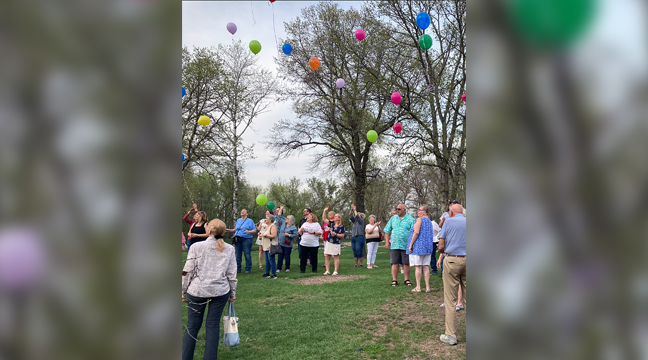 Color filled sky. Attendees of the annual cancer survivors dinner looked on in delight at the balloon release at last week’s celebration. (Photos by Mark Kolbinger.)