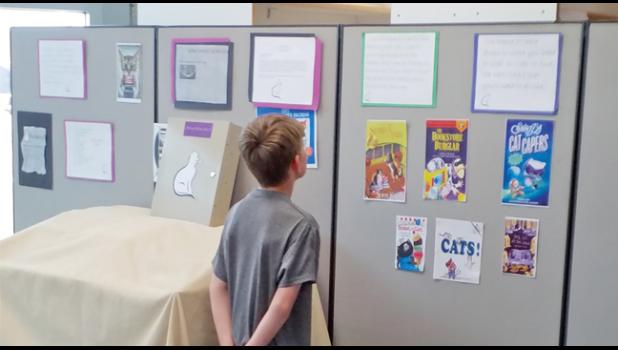 AN ESCAPE ROOM ADVENTURER (R) studies clues at Becker Library’s escape room event earlier this month. (Submitted Photo)