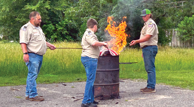 The Becker Boy Scouts lended a helping hand at the flag ceremony, ensuring a new generation was familiar with proper flag etiquette. (Patriot Photo by Mark Kolbinger).