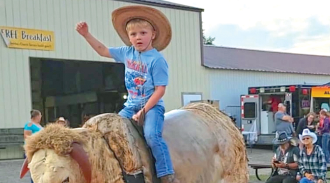 Yee-Haw! Ride ‘Em Cowboy! Henry Johnson tries his hand at riding the mechanical bull during the 45th annual Clearwater Rodeo last weekend. (Submitted Photo)