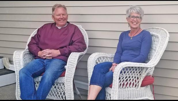 ENJOYING THE GREAT OUTDOORS. Warm mid-week temperatures found Todd and Mary Larson of Becker enjoying time outside at their home near Snake River. (Photo by Mary Nehring).