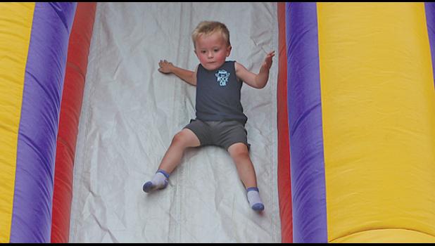 CHASE HOLKER took his turn on the inflatable slide.